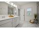 Double vanity bathroom with marble floors and a shower at 117 Arabian Drive Lot B, Summerville, SC 29483