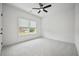 Bright bedroom with plush carpeting and large window at 117 Arabian Drive Lot B, Summerville, SC 29483