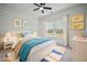 Virtually staged bedroom with white bed frame and colorful accents at 117 Arabian Drive Lot B, Summerville, SC 29483