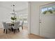 Bright dining room with light wood floors and farmhouse table at 117 Arabian Drive Lot B, Summerville, SC 29483