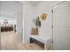 Clean entryway with bench, coat hooks, and view of kitchen at 117 Arabian Drive Lot B, Summerville, SC 29483