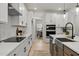 Open concept kitchen with island, stainless steel appliances, and hardwood floors at 117 Arabian Drive Lot B, Summerville, SC 29483
