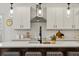 Modern kitchen island with white cabinets and quartz countertop at 117 Arabian Drive Lot B, Summerville, SC 29483