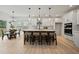 Modern kitchen boasts white cabinets, an island with seating, and high-end appliances at 117 Arabian Drive Lot B, Summerville, SC 29483