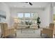 Bright living room with comfy seating, large windows, and stylish decor at 117 Arabian Drive Lot B, Summerville, SC 29483