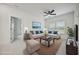Virtually staged living room with a beige sofa and blue pillows at 117 Arabian Drive Lot B, Summerville, SC 29483