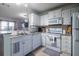 Modern kitchen with white cabinets and granite countertops at 1209 Meadow Park Ln # B, Mount Pleasant, SC 29464