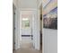 White bathroom with double vanity and walk-in closet at 1216 Hammrick Ln, Johns Island, SC 29455