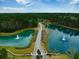 Gated community entrance with scenic lakes and fountains at 123 Beam St, Huger, SC 29450