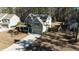 Two-story house with attached garage, driveway and landscaping at 123 Beam St, Huger, SC 29450