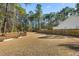 Large backyard with fenced area, providing privacy and ample space at 123 Beam St, Huger, SC 29450