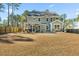 Spacious backyard with patio, pergola, and fenced yard at 123 Beam St, Huger, SC 29450