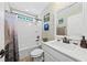 Clean bathroom with a shower/tub combo, white vanity, and a large mirror at 123 Beam St, Huger, SC 29450