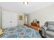 Comfortable bedroom with a dresser, seating area, and double doors at 123 Beam St, Huger, SC 29450