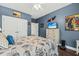 Bedroom with TV, dresser, and hardwood floors at 123 Beam St, Huger, SC 29450