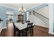Dining room with hardwood floors, a table and chairs, and blue walls at 123 Beam St, Huger, SC 29450