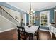 Bright dining room with hardwood floors, table, chairs, and blue walls at 123 Beam St, Huger, SC 29450
