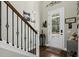 Foyer with staircase, hardwood floors, and decorative wall art at 123 Beam St, Huger, SC 29450
