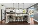 Island kitchen with granite countertops, stainless steel appliances, and white cabinets at 123 Beam St, Huger, SC 29450