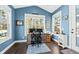 Sunroom office with built-in desk and hardwood floors at 123 Beam St, Huger, SC 29450