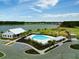 Community pool, clubhouse, playground, and lake view at 123 Beam St, Huger, SC 29450