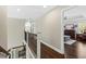 Elegant upper hallway with hardwood floors and iron railings at 123 Beam St, Huger, SC 29450