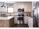 Modern kitchen with stainless steel appliances and ample cabinetry at 1225 Old Black Oak Rd, Moncks Corner, SC 29461