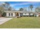 Charming light blue house with a well-manicured lawn and driveway at 1331 Saint Clair Dr, Charleston, SC 29407