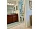 Bathroom with granite countertop, shower, and toilet at 1481 Center Street Ext # 1808, Mount Pleasant, SC 29464