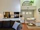 Open concept kitchen with breakfast nook and white cabinets at 1481 Center Street Ext # 1808, Mount Pleasant, SC 29464