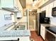 Modern kitchen with granite countertops, stainless steel appliances, and laundry area at 1481 Center Street Ext # 1808, Mount Pleasant, SC 29464
