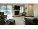 Relaxing living room with fireplace, access to balcony, and lake views at 1481 Center Street Ext # 1808, Mount Pleasant, SC 29464