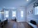 Light and airy entryway with hardwood floors and a bench at 1573 Trailmore Ln, Summerville, SC 29486