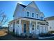 Two-story house with gray siding, a front porch, and a two-car garage at 1573 Trailmore Ln, Summerville, SC 29486