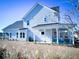 Two-story house with covered patio and grassy yard at 1573 Trailmore Ln, Summerville, SC 29486