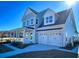 Two-story house with double garage and front porch at 1573 Trailmore Ln, Summerville, SC 29486