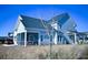 Two-story house with screened porch and landscaped yard at 1573 Trailmore Ln, Summerville, SC 29486