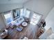 High-ceilinged living room with hardwood floors, comfy seating, and access to a deck at 1573 Trailmore Ln, Summerville, SC 29486