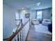 Spacious loft area with hardwood floors, comfortable seating and a view at 1573 Trailmore Ln, Summerville, SC 29486
