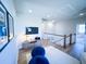 Bright loft area features hardwood floors, comfortable seating and a view of the staircase at 1573 Trailmore Ln, Summerville, SC 29486