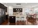 Modern kitchen with dark cabinets, granite countertops and island at 1687 Seabago Dr, Charleston, SC 29414