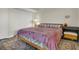 Bedroom with king-size bed, dresser, and patterned rug at 1723 Live Oak Park # 1723, Seabrook Island, SC 29455