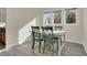 Small dining area with white table and green chairs at 1723 Live Oak Park # 1723, Seabrook Island, SC 29455