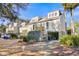 Light beige exterior of townhouses with parking and landscaping at 1723 Live Oak Park # 1723, Seabrook Island, SC 29455