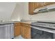 Galley kitchen with stainless steel appliances and wood cabinets at 1723 Live Oak Park # 1723, Seabrook Island, SC 29455