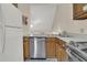 Galley kitchen with stainless steel appliances and wood cabinets at 1723 Live Oak Park # 1723, Seabrook Island, SC 29455