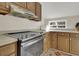 Modern kitchen features stainless steel appliances and wood cabinets at 1723 Live Oak Park # 1723, Seabrook Island, SC 29455