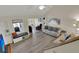 Open living room with vaulted ceiling, hardwood floors, and comfy seating at 1723 Live Oak Park # 1723, Seabrook Island, SC 29455
