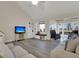 Living room with hardwood floors, access to sunroom and water views at 1723 Live Oak Park # 1723, Seabrook Island, SC 29455