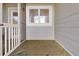 Small screened porch with wooden floor and white door at 1723 Live Oak Park # 1723, Seabrook Island, SC 29455